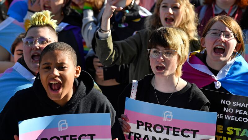 FILE - Protesters of Kentucky Senate Bill SB150, known as the Transgender Health Bill, cheer...