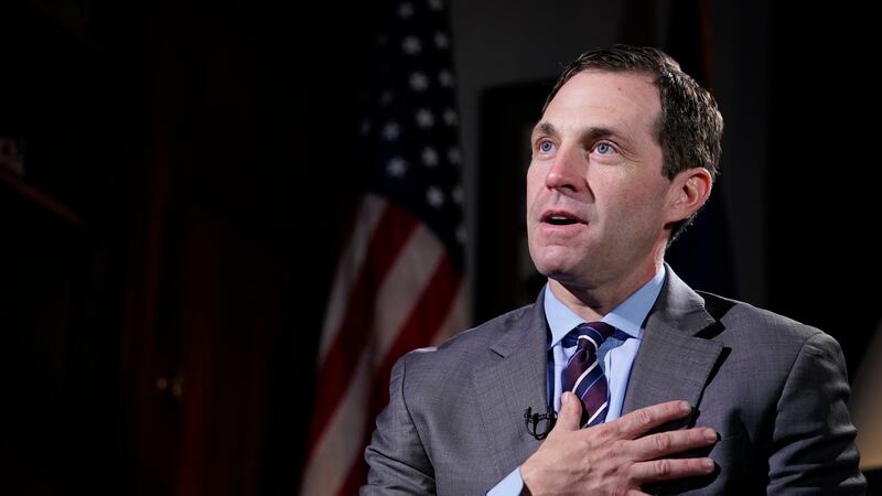 FILE - Rep. Jason Crow, D-Colo., talks during an interview with The Associated Press in his...