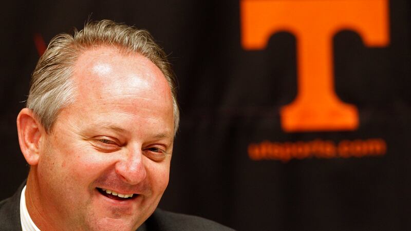 FILE - In this June 7, 2011, file photo, Mike Hamilton smiles during a news conference...