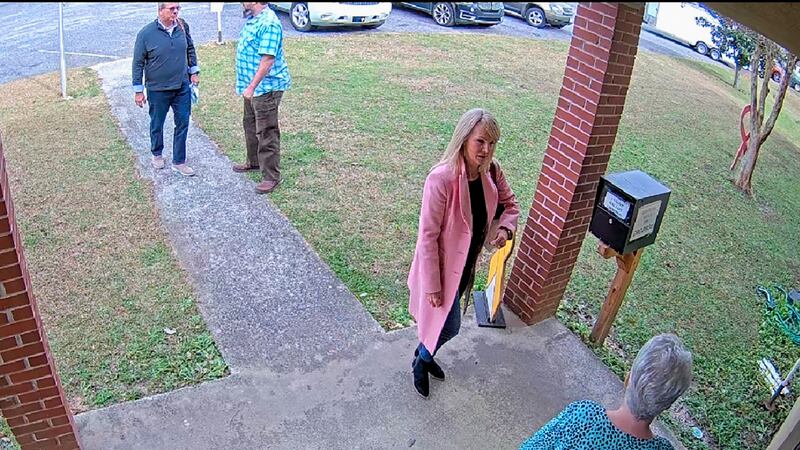 FILE - In this image taken from Coffee County, Ga., security video, Cathy Latham, bottom,...