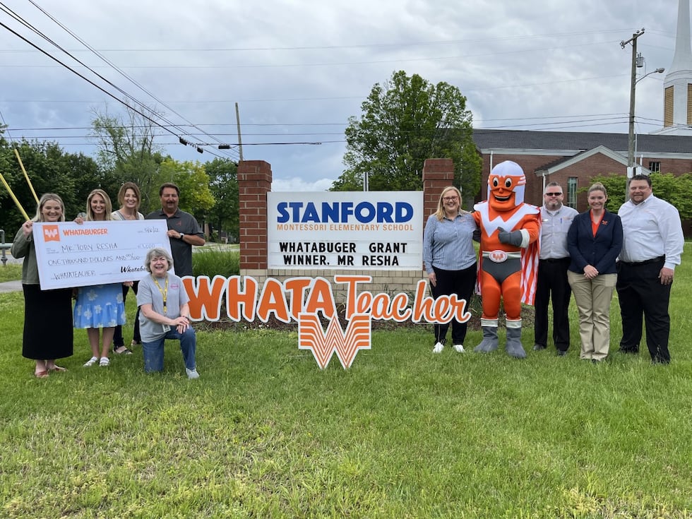 Stanford Elementary School teachers hold grant from Whataburger.