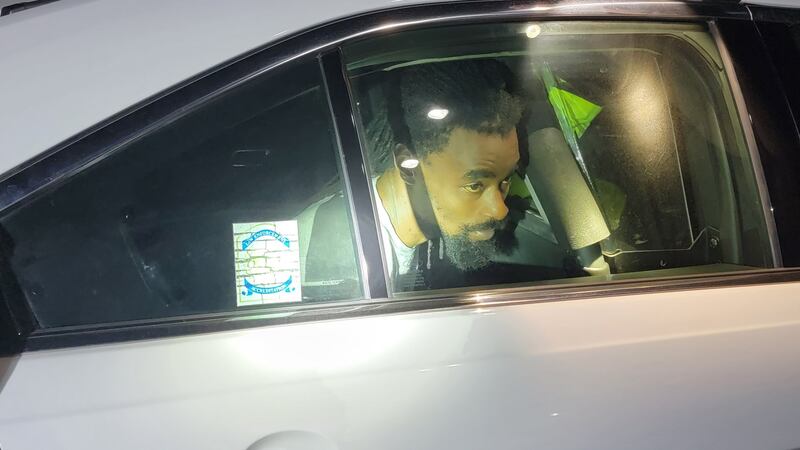 Shaquille Taylor in the back of a Metro Nashville Police Department cruiser.