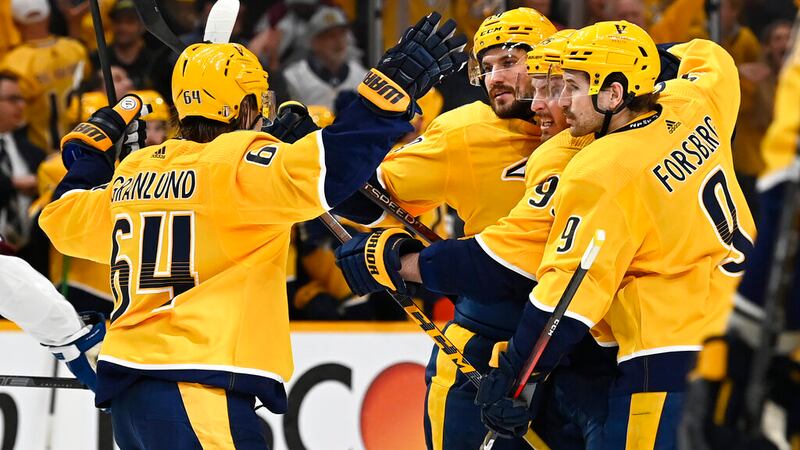 Nashville Predators defenseman Roman Josi, second from left, celebrates with teammates after...