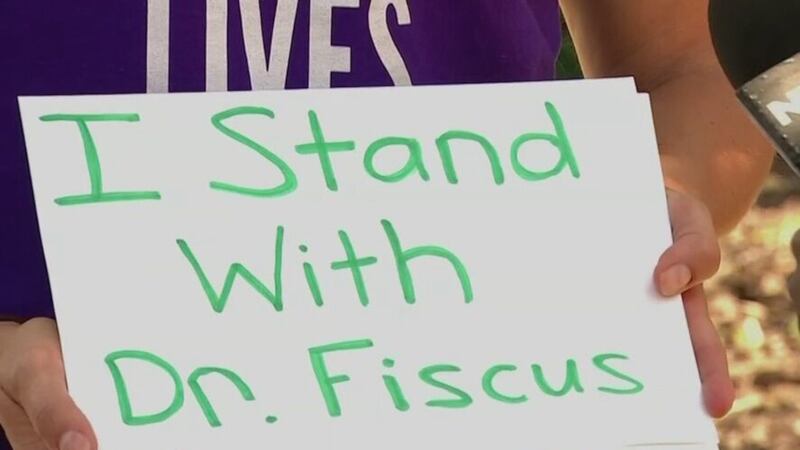 A protester on the Legislative Plaza supports Dr. Michelle Fiscus prior to a meeting of the...